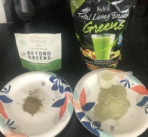 a total living drink greens dosage next to a beyond greens dosage